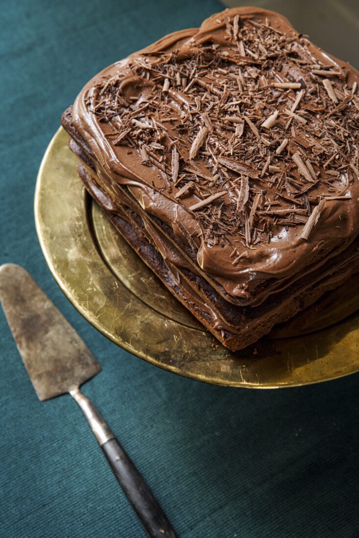 An aerial view of a triple-layer chocolate cake.