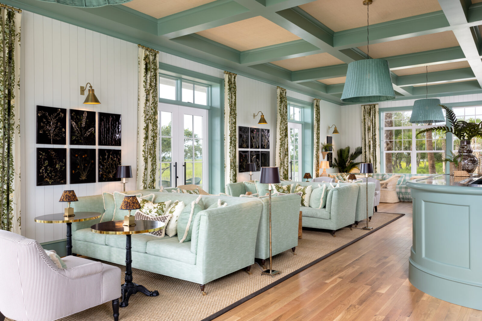 A hotel lobby with light teal sofas