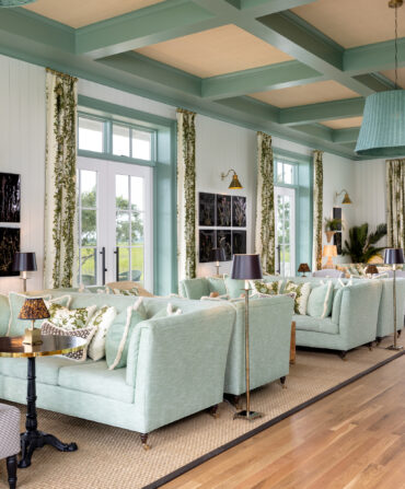 A hotel lobby with light teal sofas