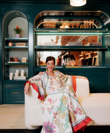 A woman lounges in a navy shop