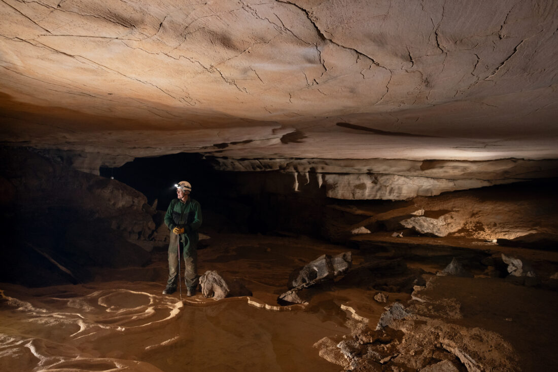 A man stands in a cave