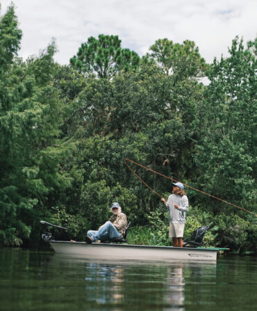 Two men cast from a small boat