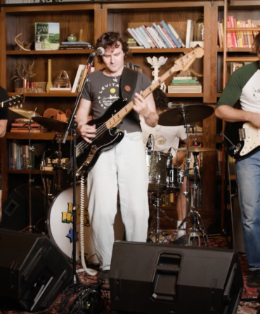 A band plays in a library setting