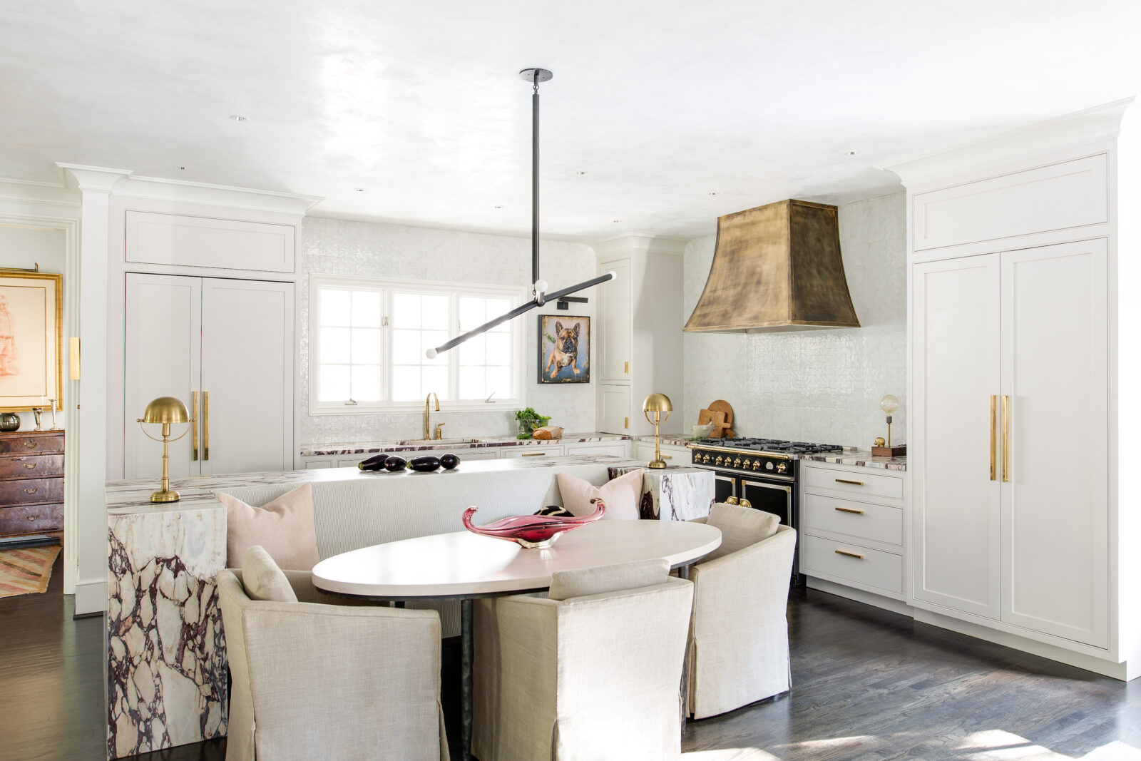 A brass hood in a white kitchen
