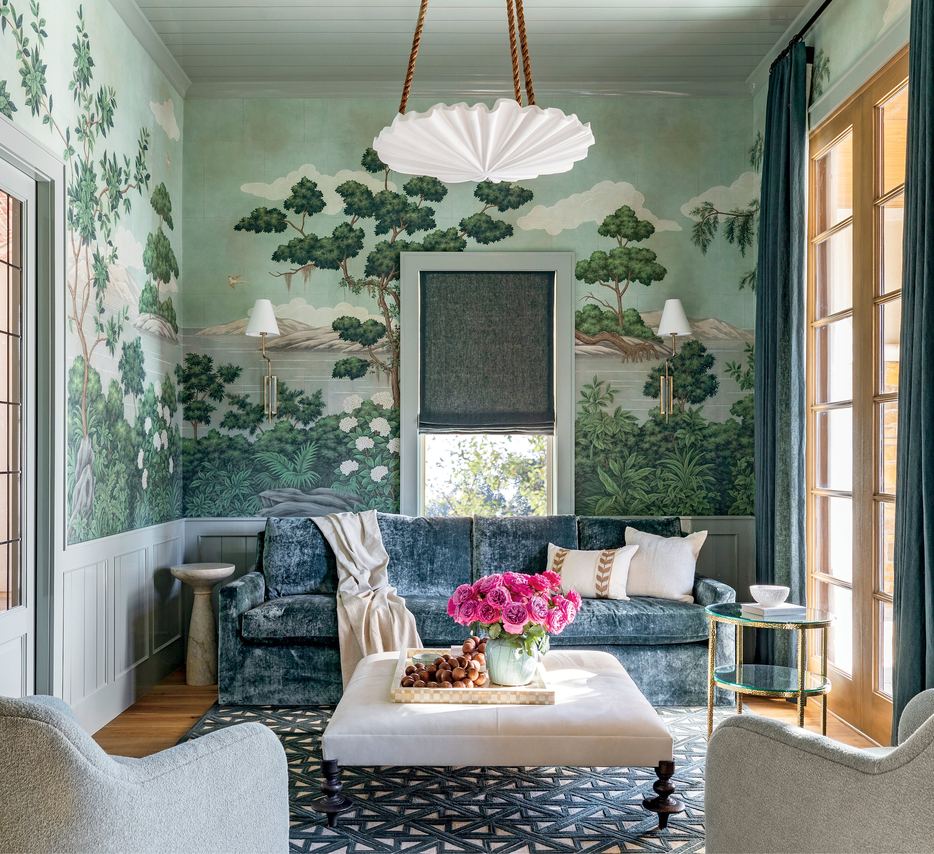 A green wallpapered room features mountains and vegetatian