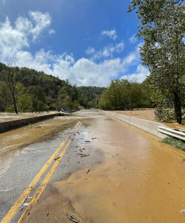 A river overflowing a road