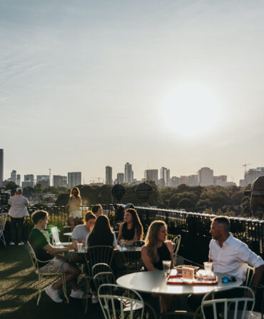 A rooftop bar with a skyline view of Atlanta