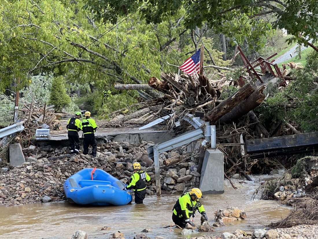 People work to remove tree debris