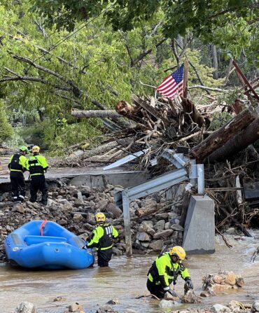 People work to remove tree debris