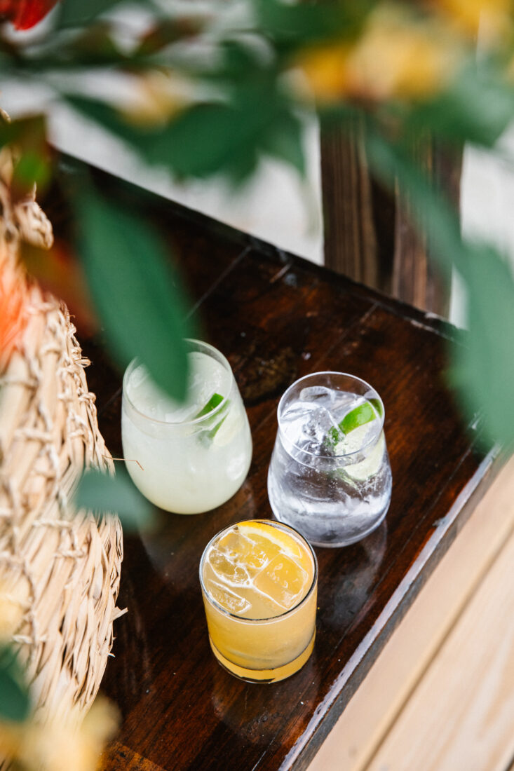 The event’s featured cocktails (clockwise top left): the Paloma, the zero-proof Gee & Tee, and the Bourbon Bird.