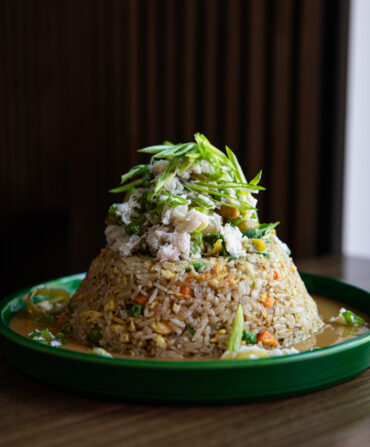 A pile of crab fried rice with gravy at Beautiful South