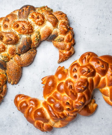 Two loves of challah shaped like alligators