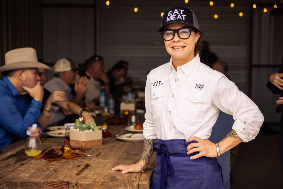 A chef stands at a table