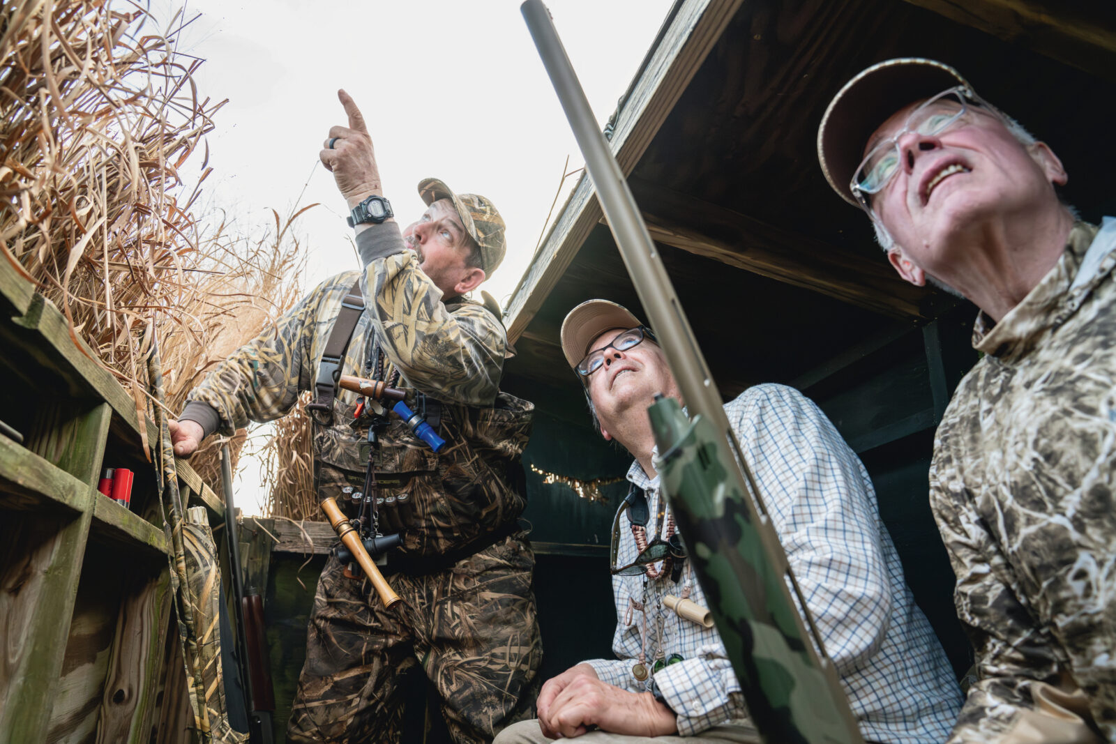 Men sit in a duck blind