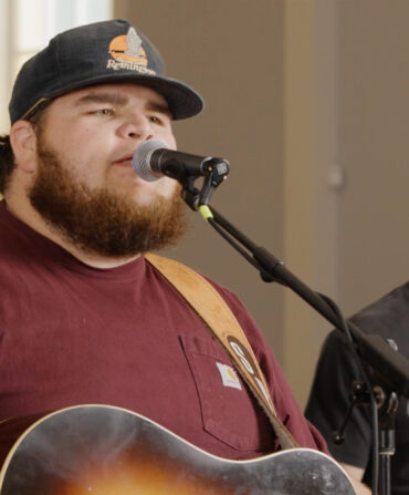 A man singing at a microphone