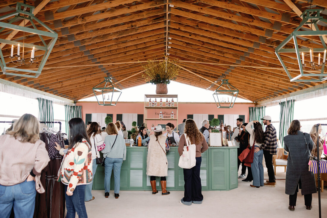 Guests stop in for cocktails and shopping at the G&G Club Pop-Up curated by Holloway Events, designed to embody the timeless charm of Charleston’s iconic Rainbow Row.
 