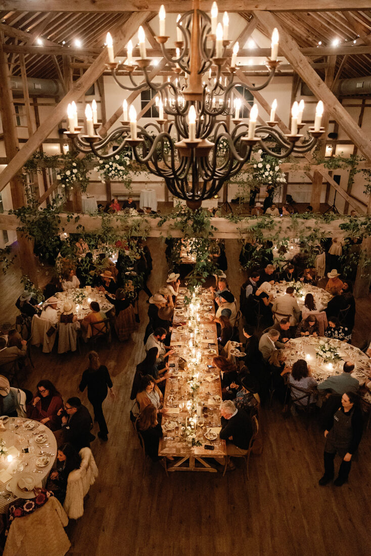 Guests take their places for a candlelit supper.