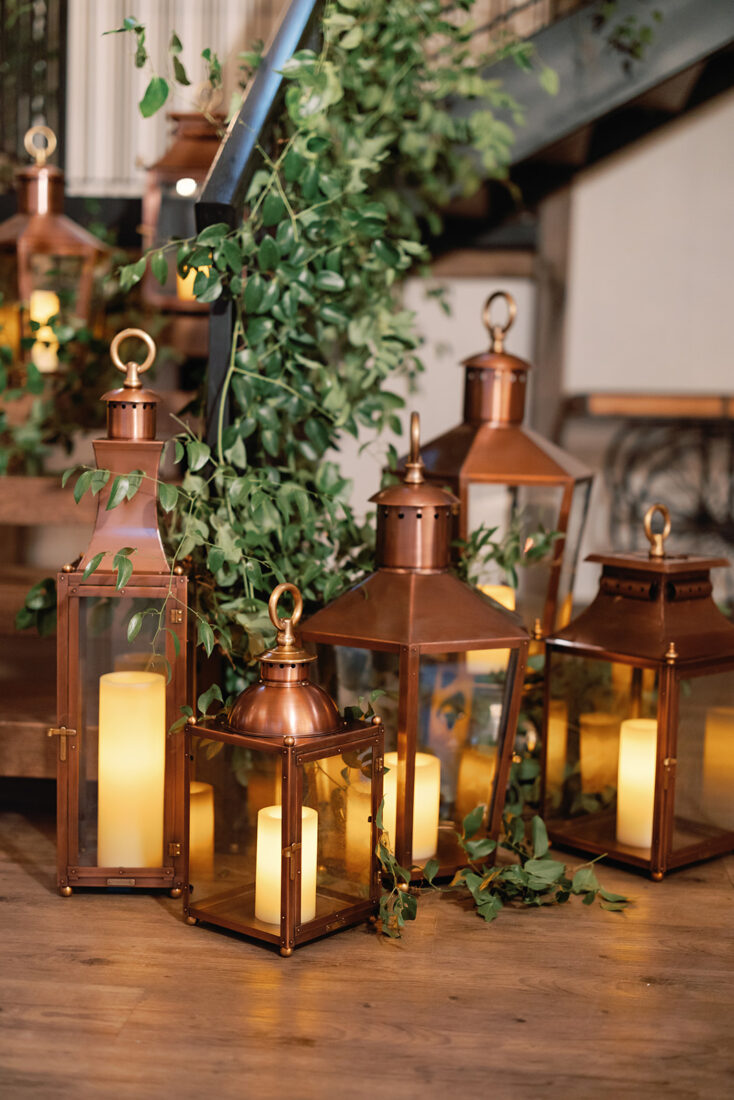 Lanterns from Bevolo Gas & Electric Lights illuminate the space.