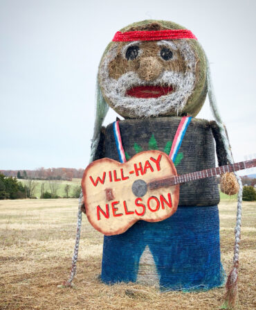 A hay sculpture of Willie Nelson