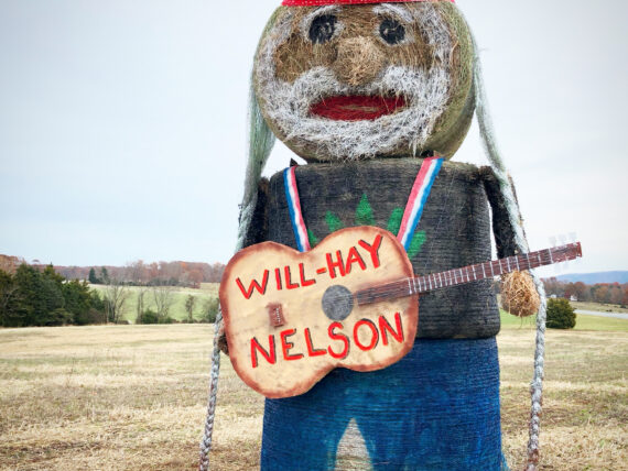 A hay sculpture of Willie Nelson