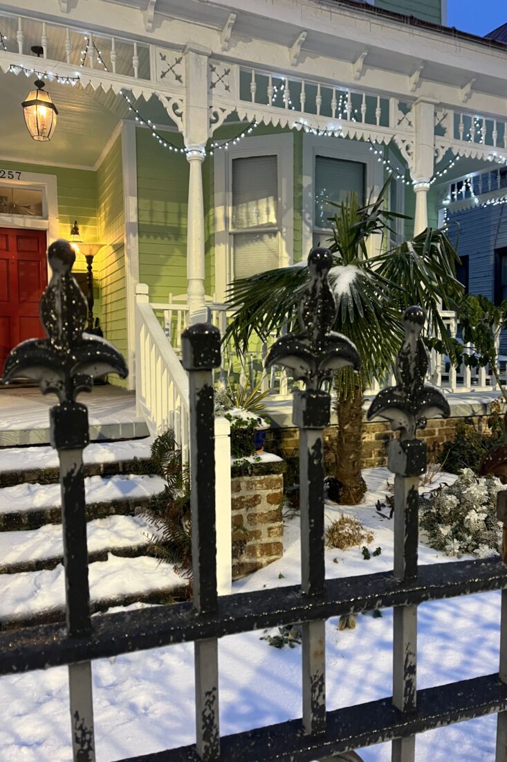 A green house in the snow