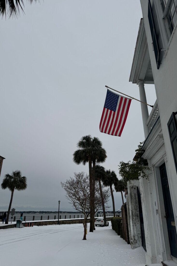 Historic homes overlooking the water on a snowy day