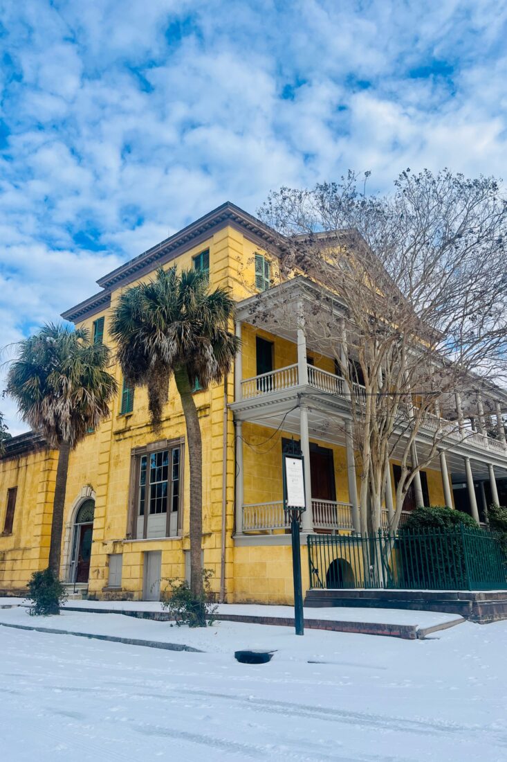 A yellow house in the snow