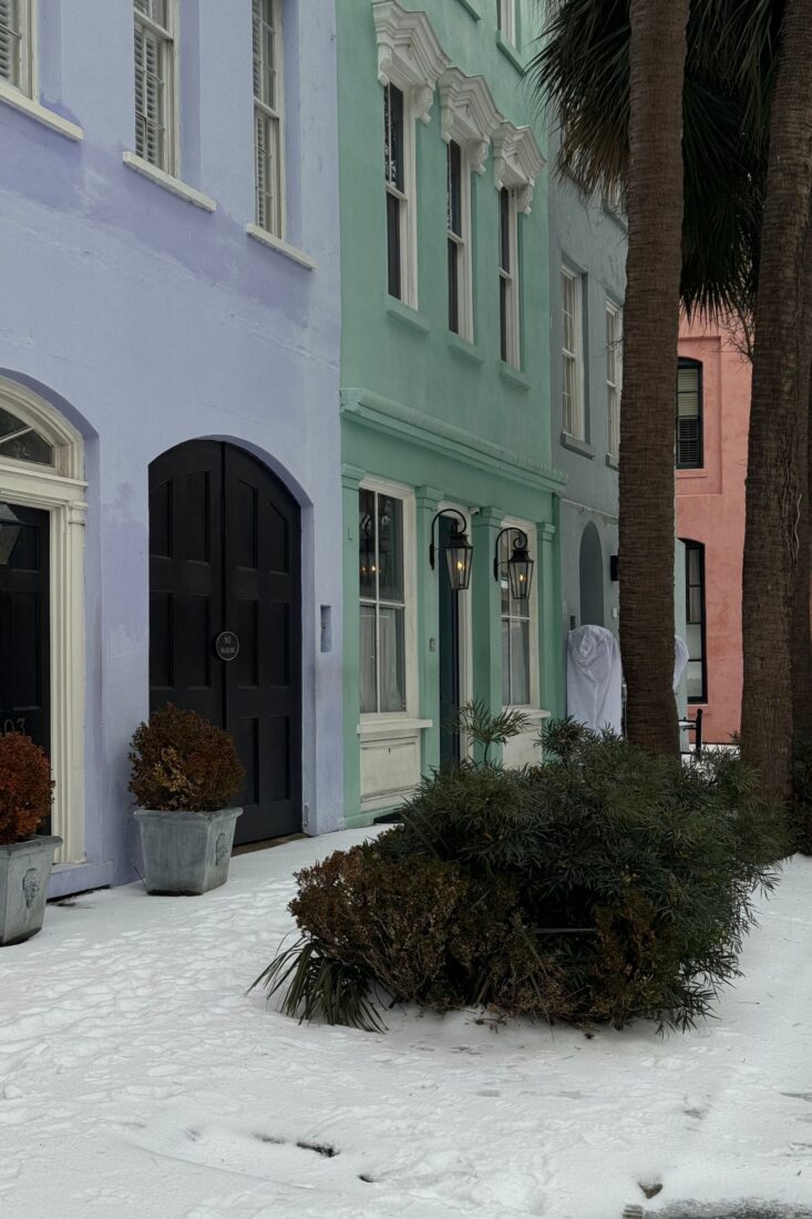 A row of colorful townhouses in the snow