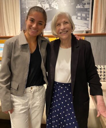 A woman stands next to Nathalie Dupree