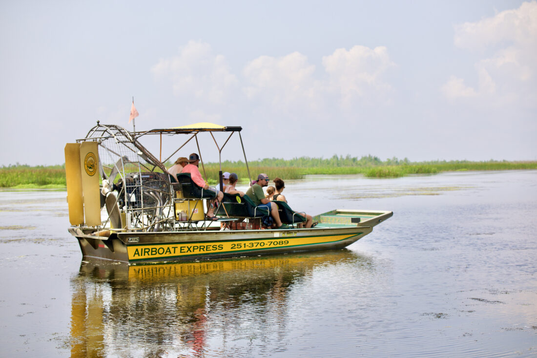 People ride around on an airboat