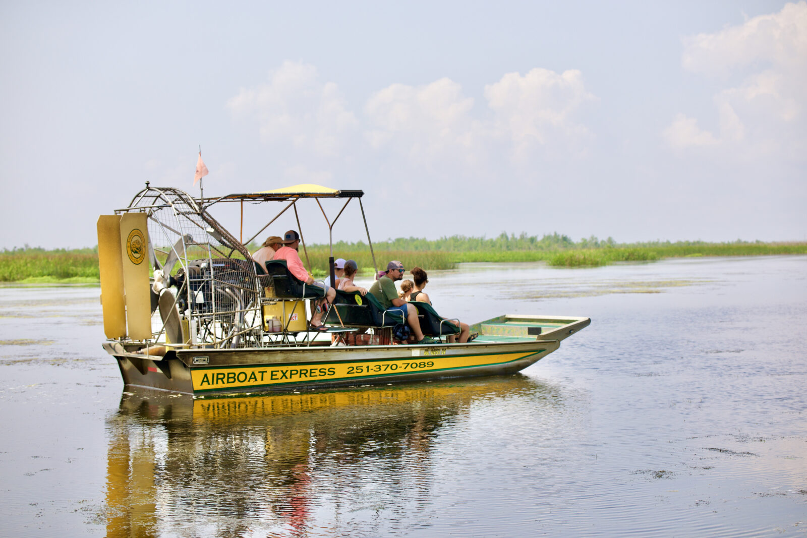 People ride around on an airboat
