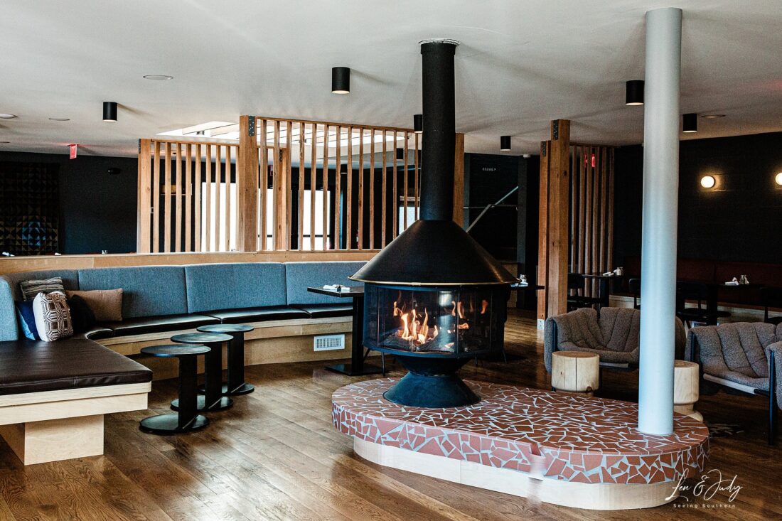 Inside a motor lodge with a wood burning stove