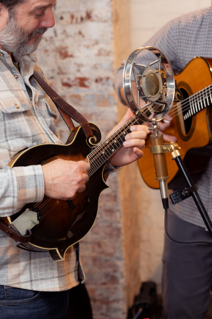 The Bluestone Ramblers welcome guests with lively bluegrass tunes.