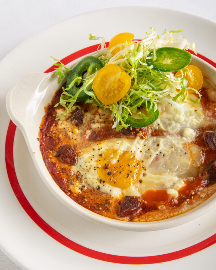 A dish of Eggs Pipérade with Creole sauce