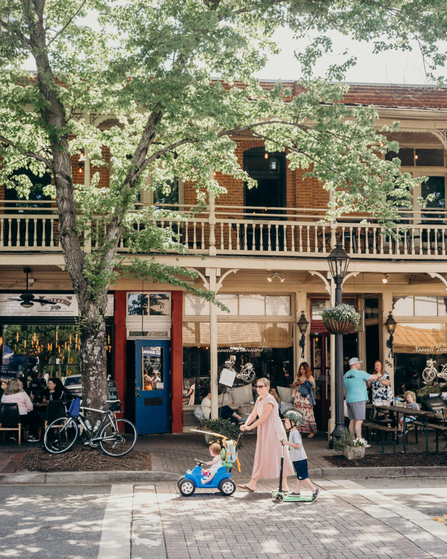 A family walks down a historic street