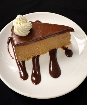 A slice of chocolate cheesecake on a plate