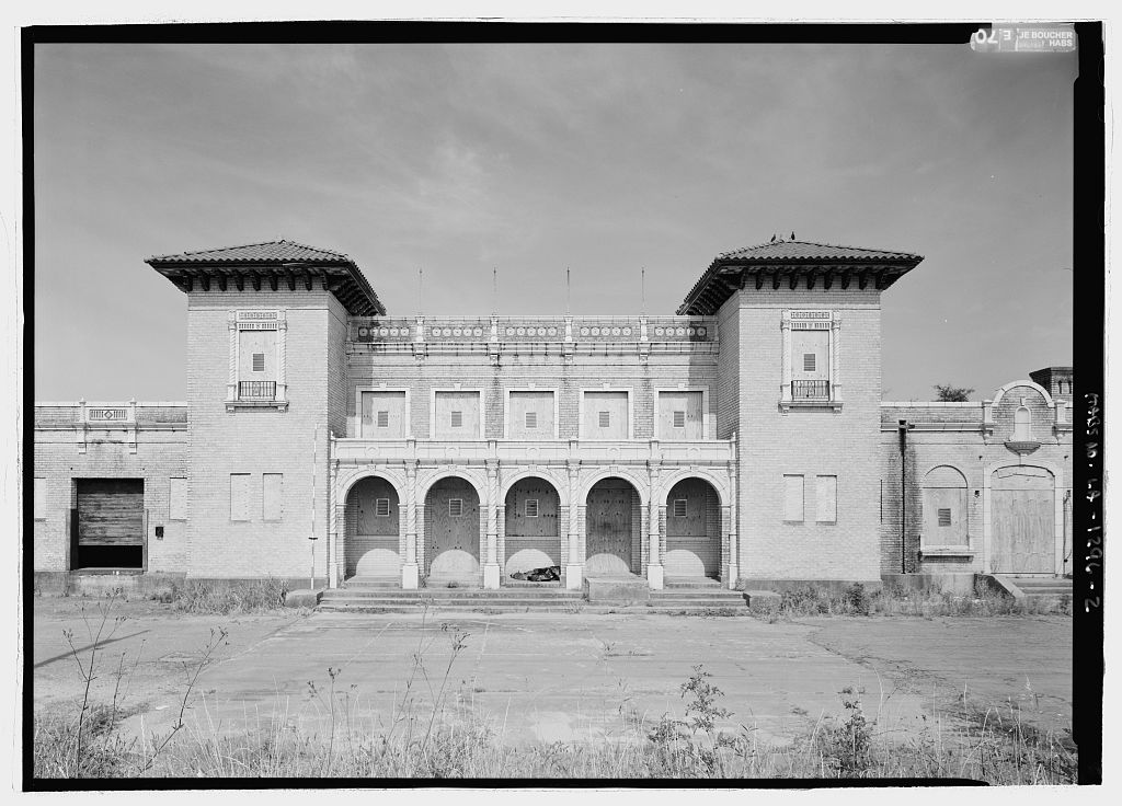 An old black and white photo of a train station