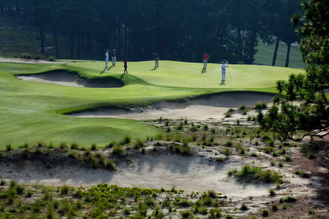 People golf on a golf course