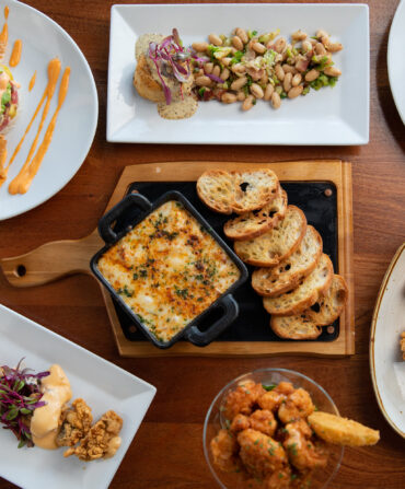 A spread of seafood plates on a table