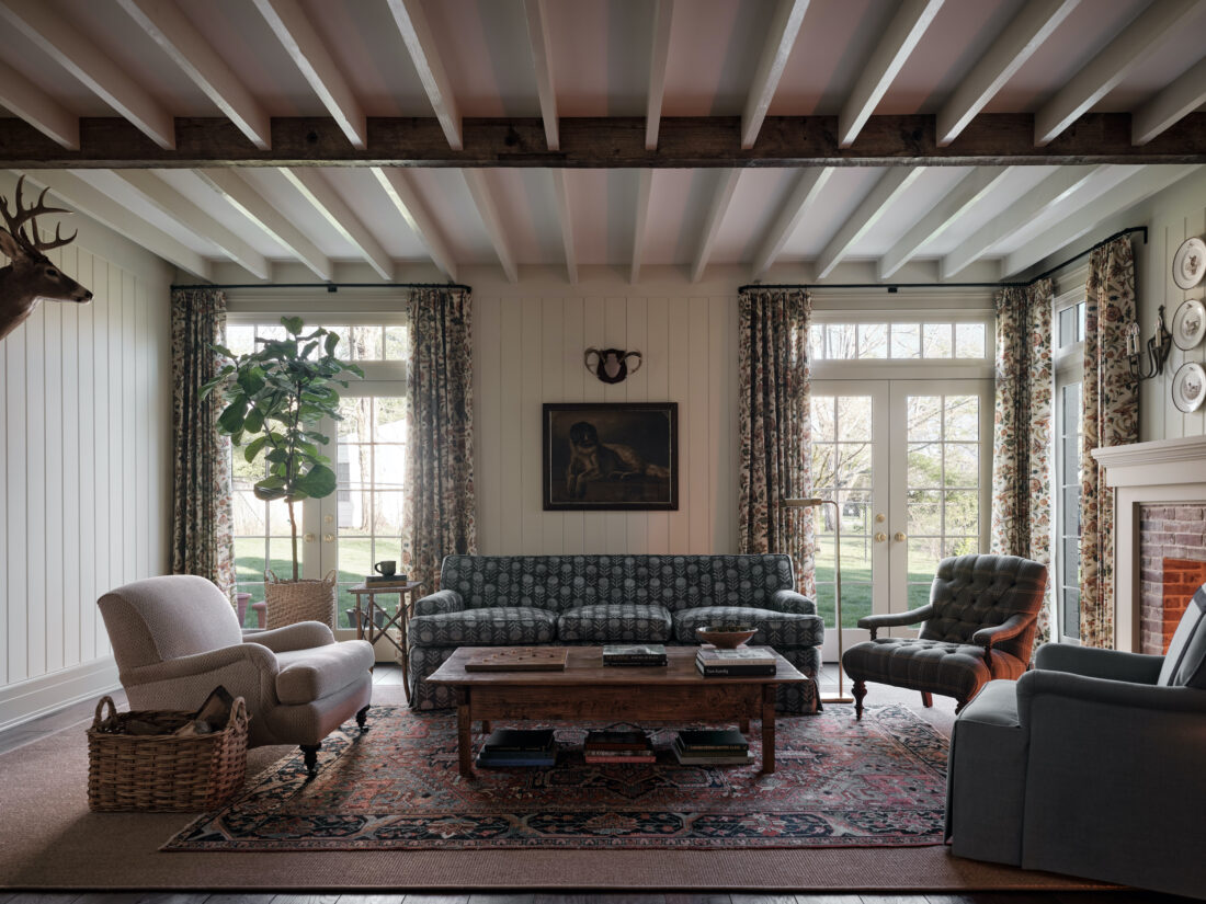 A living room with exposed beam ceiling details