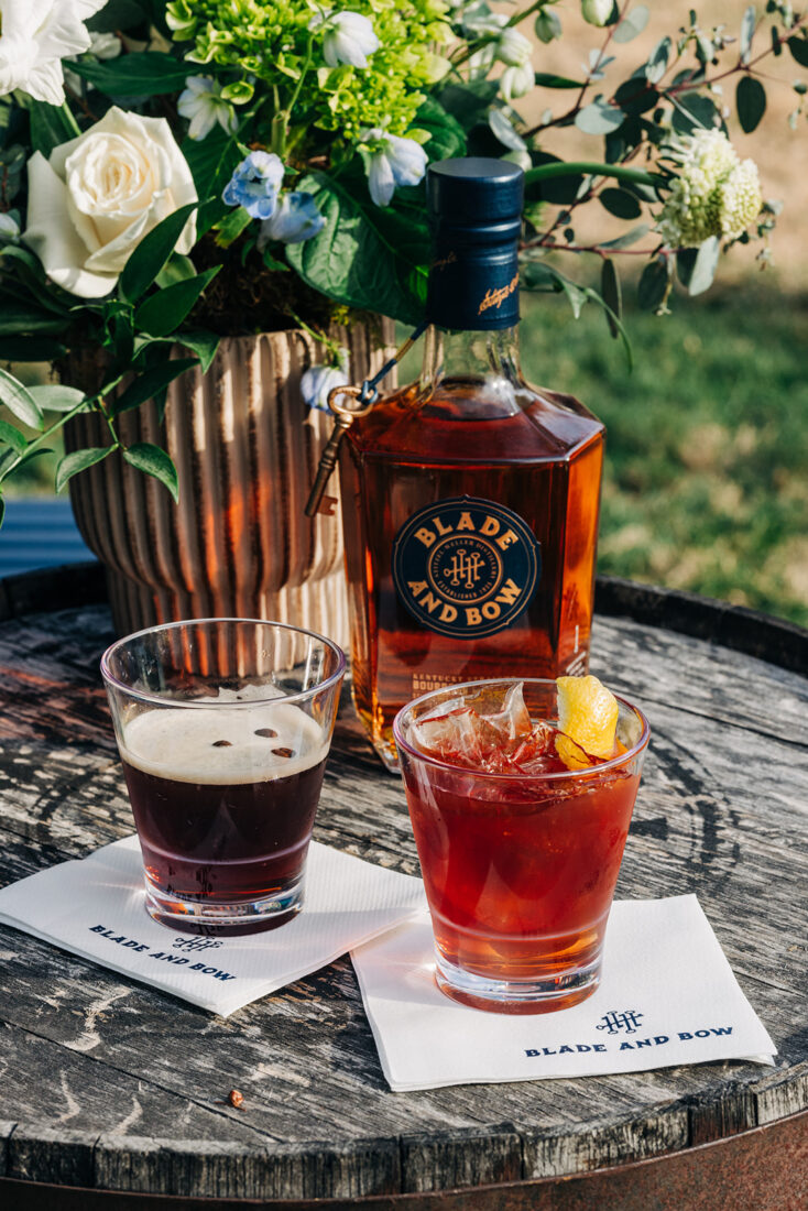 The featured cocktails: the Key Player, comprised of Blade and Bow, herbal-based Italian liqueur, cold brew concentrate, and Big Bear coffee and cocoa bitters; and the Love Minus Zero, comprised of Blade and Bow, vermouth, amaro, bitters, and chili liqueur.