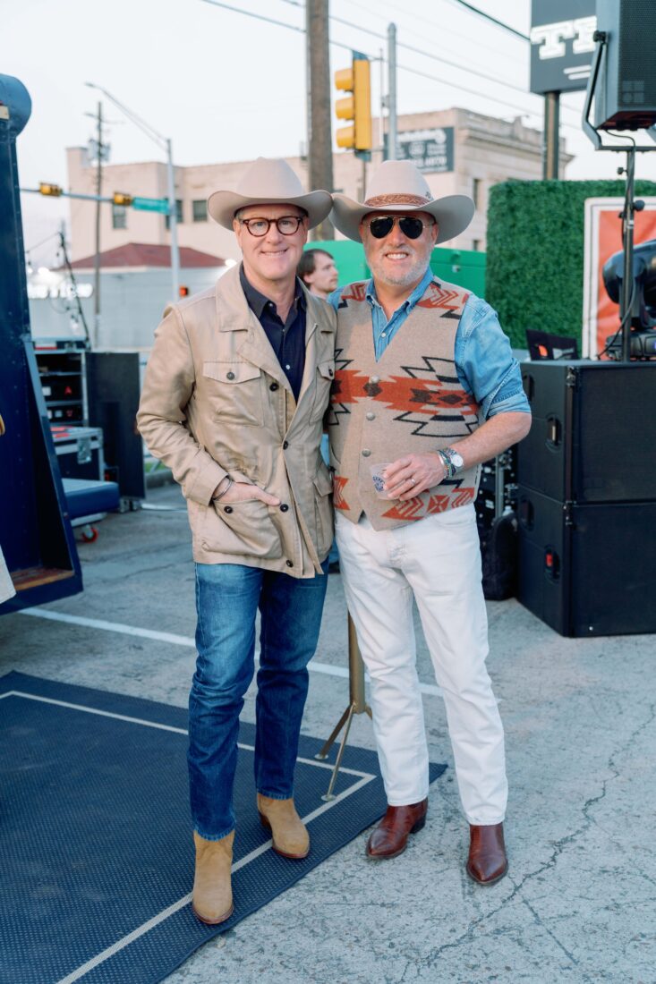 Peter Cooper and Jeff Parrott, Blade and Bow brand cultivator, listen to Steel Grassy’s set.