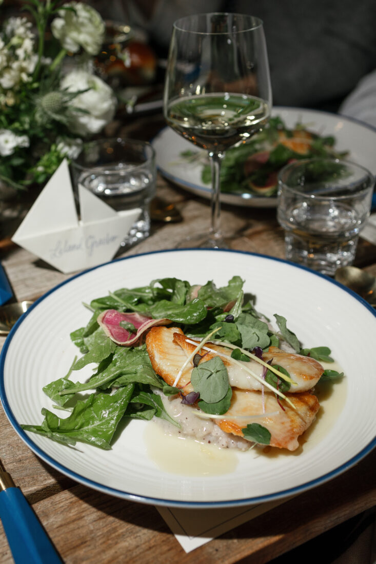 The main course: sea bass and Jimmy Red grits with arugula, radish, and lobster butter.