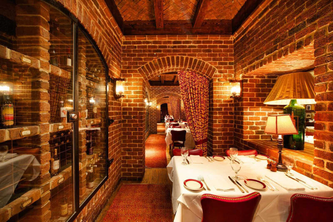 The inside of Bones steak house, showing tables