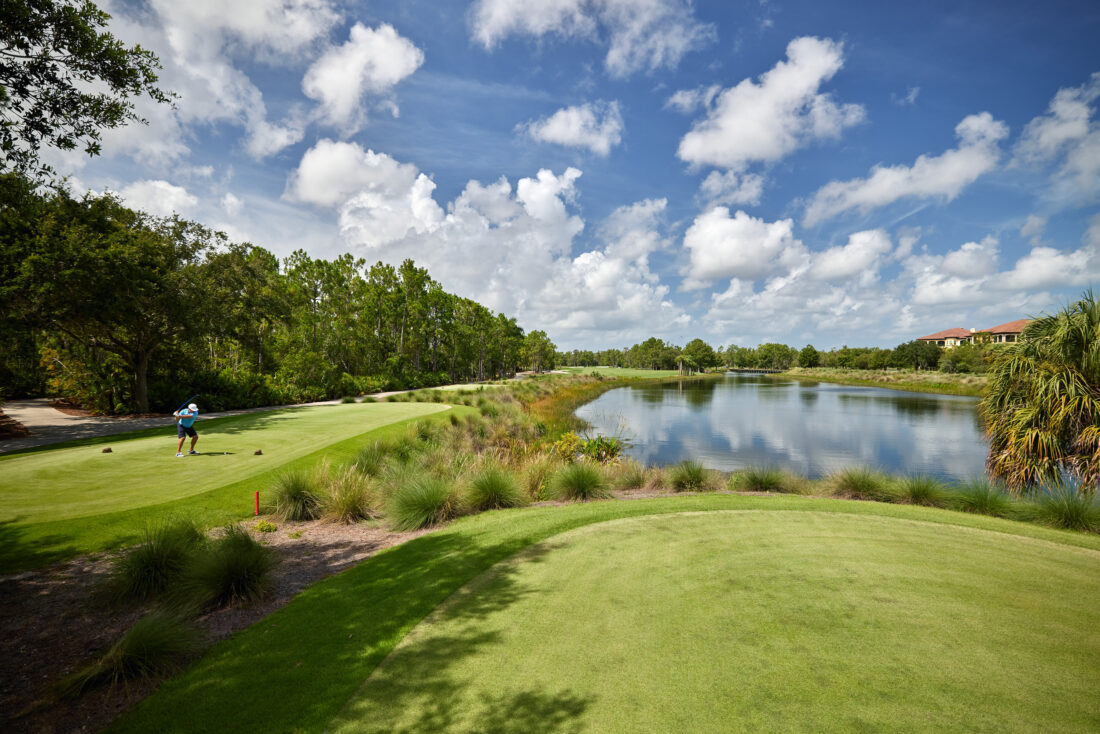 A golf course with a pond