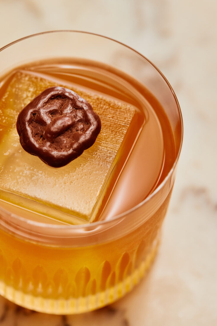 An orange cocktail in a glass