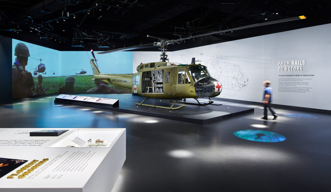 A helicopter in a military exhibit in a museum