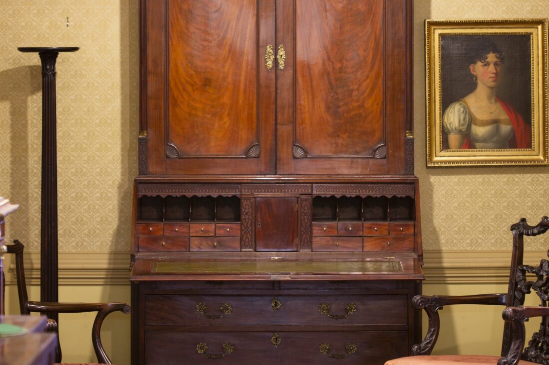 An antique desk and chair