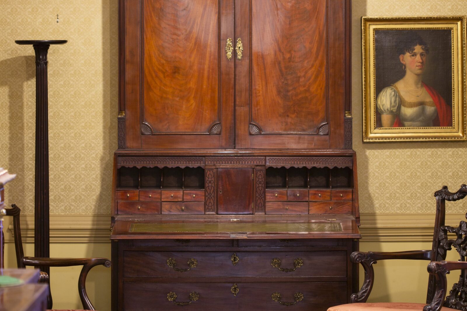 An antique desk and chair