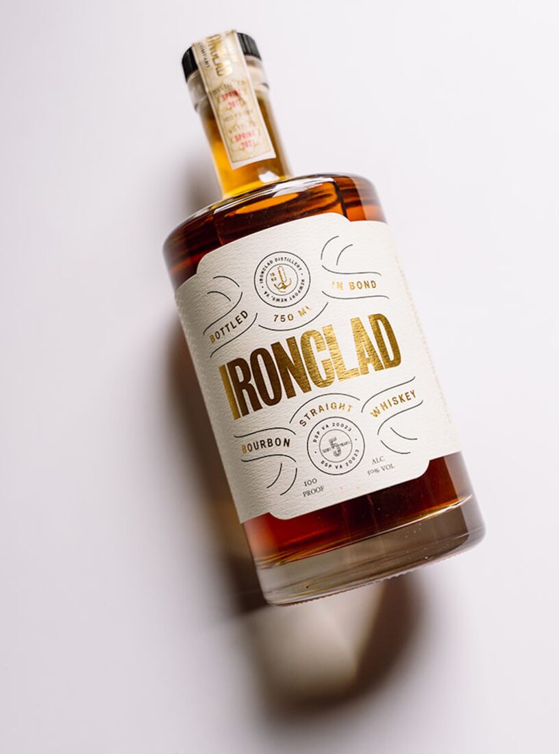 A bottle of bourbon against a white backdrop